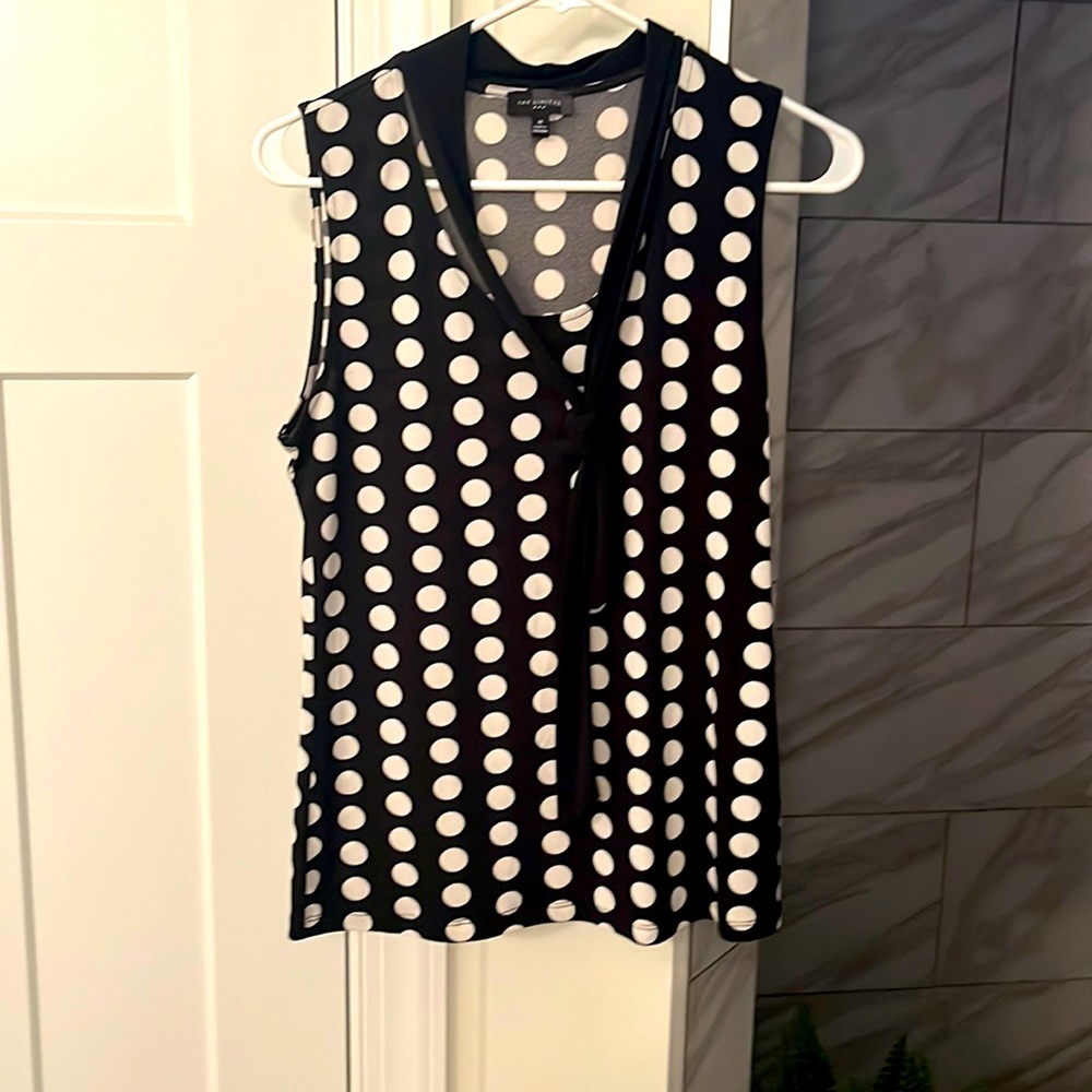 Women’s sleeveless top, with “tie like” accent from the limited